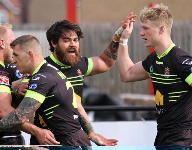 Sammy Gee give high five to Kieran Gill after scoring Oldham 3rd Try 