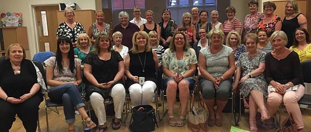 ALL smiles . . . the ladies at Chadderton WI, which celebrates its first birthday in June