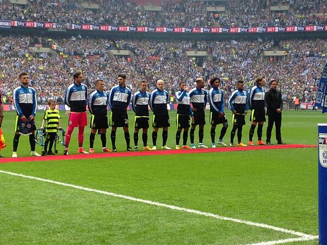 LUCAS lines up with the Huddersfield players at Wembley 