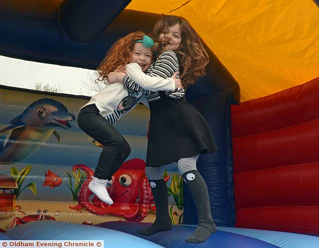 JUMPING for joy . . . sisters Edie and Niamh Palmer are all smiles after trying out the bouncy castle