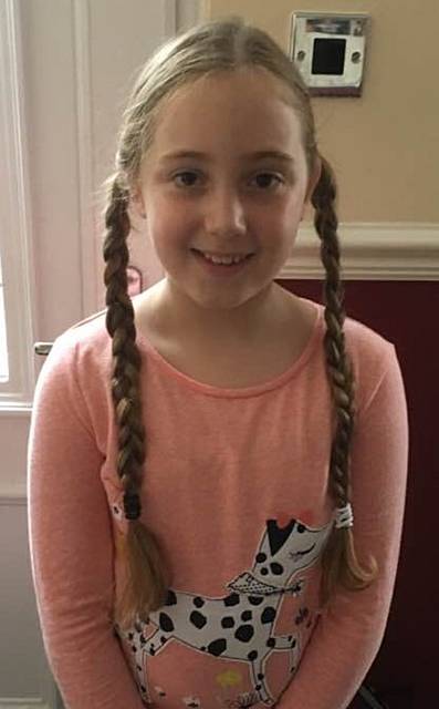 Emily Mahoney, of Trinity Brownies, Royton, had her hair cut for Little Princess Trust