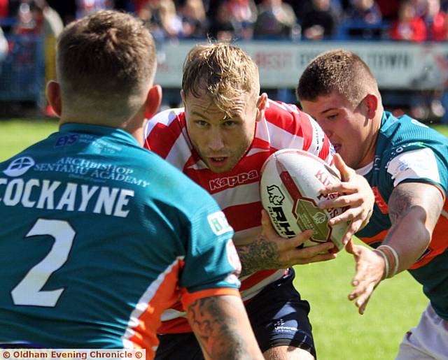 I'VE GOT MY EYES ON YOU . . . Danny Langtree powers towards the Hull KR line.