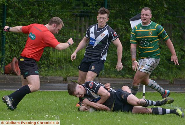 OVER HE GOES . . . Saddleworth's Sam Hart scores the hosts' first try