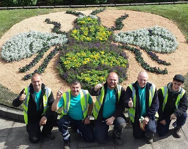 TEAM effort . . . Howard Wild, Tony Shirtcliffe, Marcus Davies, Stephen Parrot and Kyle Stokes, from Chadderton Garden Team, who created the Manchester Bee flower bed outside the town hall
