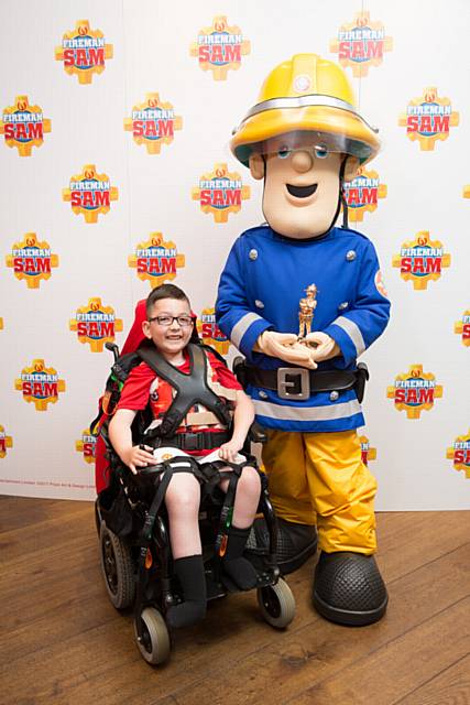 Fireman Sam honours Kareem Ali (8) with a 'real-life' hero award at the first-ever Golden Helmet Awards in London.