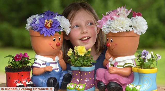 FLOWER power . . . Lilly Fitzpatrick (9) loves the flower stall at Dr Kershaw's Hospice summer fair