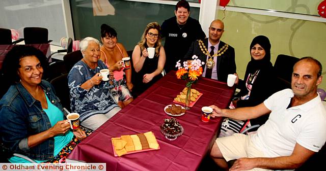 TEA-TIME . . . The Great Get Together at Tesco Failsworth are (from left) Jean Y Enisuoh, Norma Stenchion, Maria Crolla, manager Leanne Byrne, Tesco Failsworth community champion Rose Knipe Mayor of Oldham, Shadab Qumer, Mayoress of Oldham, Sobia Arshi and Mark Stuart
