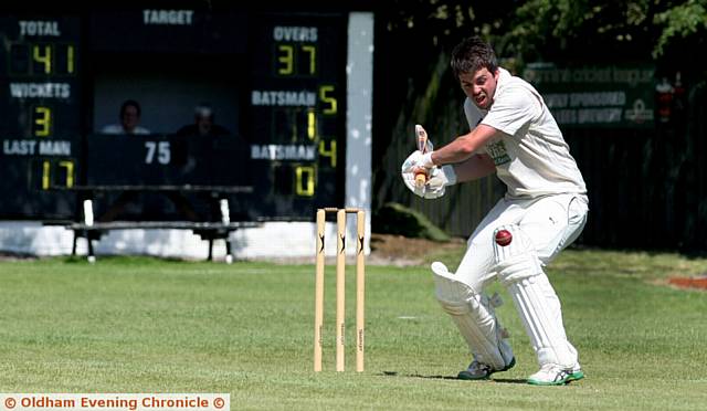 BACK-FOOT SHOT . . . Heyside skipper Ryan Barnes looks for runs against Walsden