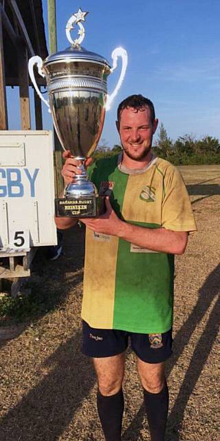 TAKE A LOOK AT THAT . . . Adam Waterhouse with trophy