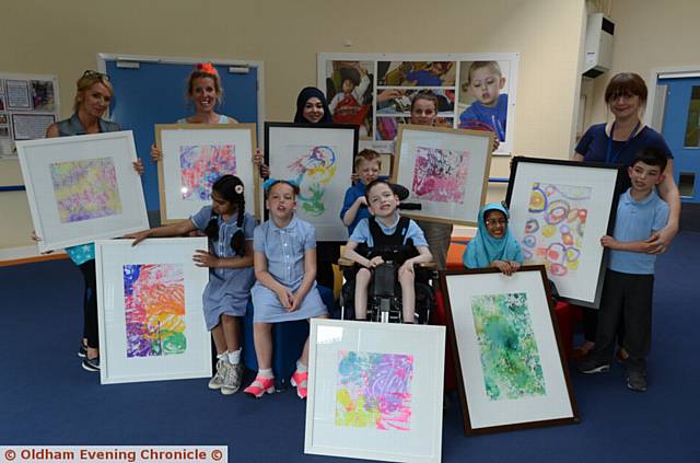 PUPILS at Kingfisher Special School with some of their art work framed for the Colour Pop gallery exhibition, to raise money for the school's hydrotherapy pool. Back left to right, Diane Molden (teaching assistant), Nic Found (director of creative learning), Muna Inam, Chelsea Beards (teaching assistants.), Michelle Flye (teacher). Front left to right, Aishah Irfan, Daisy Hampson, Thomas Wilshaw, Phoenix Knight, Imama Noor and Jayden Mack-Purcell