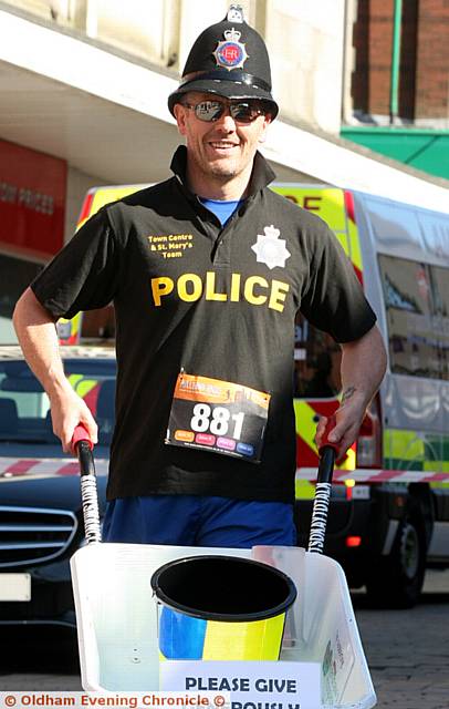 PC Damieon Hartley-Pickles running for Dr Kershaw's Hospice and Andy's Man club