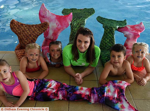 TRAINEE mermaids . . . Youngsters with their mermaid 'monofins' at Dolphin Academy (back from left), Freya Butler, Ayla Flint, Rebecca Miniham, Nathaniel Jacobs and Mila Rose Jacobs with (front) Emilia Varey
