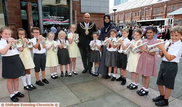 ALL lined up . . . pupils from SS Aidan & Oswald Primary School, Oldham, with Oldham Mayor Shadab Qumer and Mayoress Sobia Arshi 