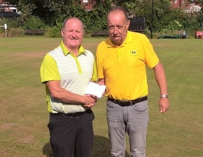 Ashley Daykin (left) receives his £1,000 prize from competition organiser Grahame Flint