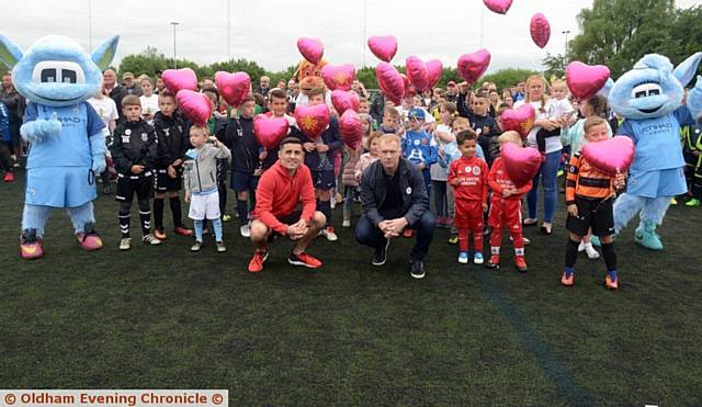 UNITED . . . Boxer Anthony Crolla and footballer Paul Scholes with youngsters release balloons at the football marathon at Curzon Ashton
