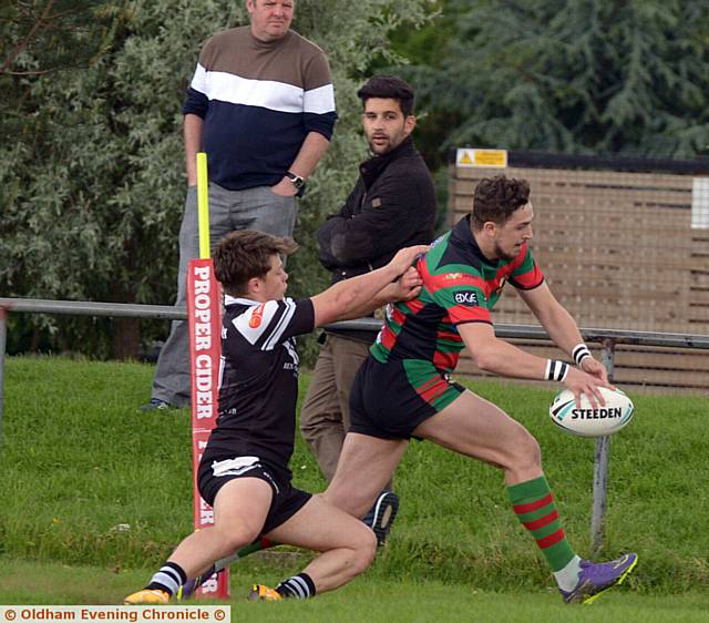 TRY TIME . . . Waterhead's Jake Maher scores in the corner