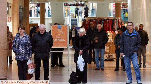 TRIBUTE . . . A minute's silence is observed in the Spindles Town Square Shopping Centre for London terror attack victims