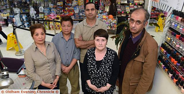 WET, wet, wet . . . traders complain about the leaks. From left,  Kieu Thi Nguyen, Chuoi Tran, Mohammed Safdar, Joyce Cumpsty and Shahid Mahmood.
