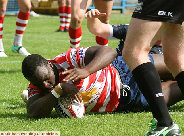 TRY TIME: Powerful forward Sadiq Adebiyi crashes over the line to score for Oldham