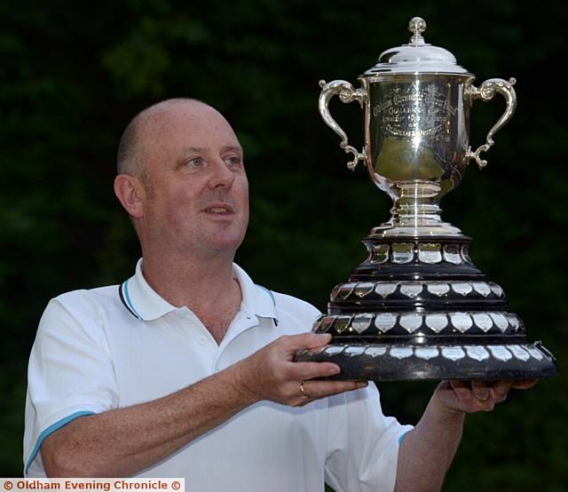 HE'S DONE IT AGAIN . . . Darren Griffiths shows off the Green Final Bowling Handicap trophy