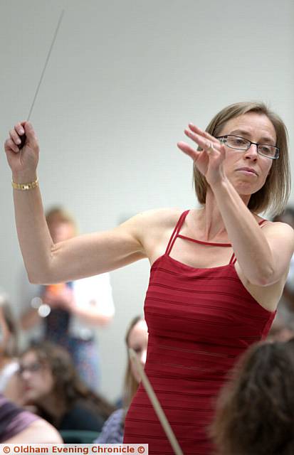 FOLLOW me . . . 

conductor of the 

Intermediate 

Orchestra, Tracey Hartnell-Booth