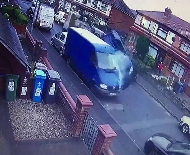 The shocking moment a stolen 18-tonne lorry crashes through Hadfield Street in Oldham, Manchester, leaving a trail of destruction in its path