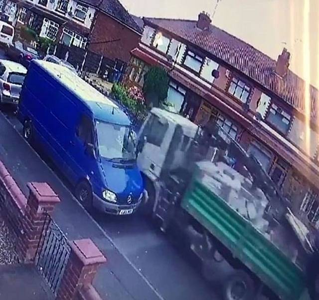 The shocking moment a stolen 18-tonne lorry crashes through Hadfield Street in Oldham, Manchester, leaving a trail of destruction in its path