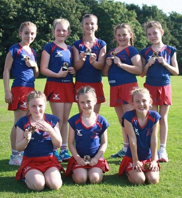 SUCCESS ALL ROUND:The victorious under-10s team is pictured showing off their medals.