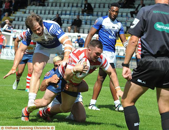 NIELD NAILS IT: Oldham's Steven Nield scores his side's first try against Toulouse at Bower Fold.
