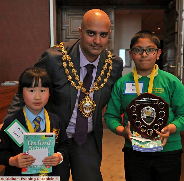OLDHAM'S Mayor Councillor Shadab Qumer with runner-up, St Margaret's pupil Yi-Lin Yu (left) and winner Abid Ali