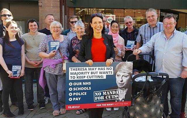 DEBBIE Abrahams MP set up a stall in Oldham town centre as she took part in the Labour Party's national day of campaigning against Government cuts