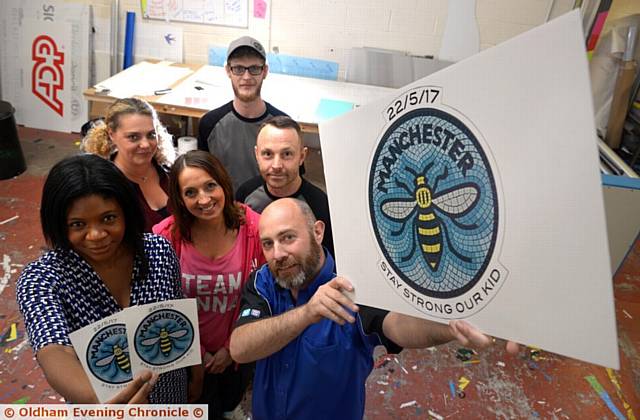 Broken Pencil offices at Parkside Industrial Estate, Royton, Doing Biz for Yourself networking group all lent a hand to produce bee stickers for victims of Manchester Arena attack. (l-r) Dawn Torrington of Doing Biz for Yourself and Chris Stansfield of Broken Pencil.