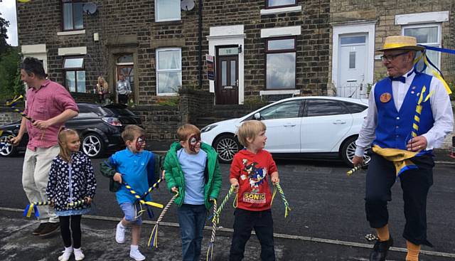 YOUNGSTERS join in the dance with Mossley Morris Men