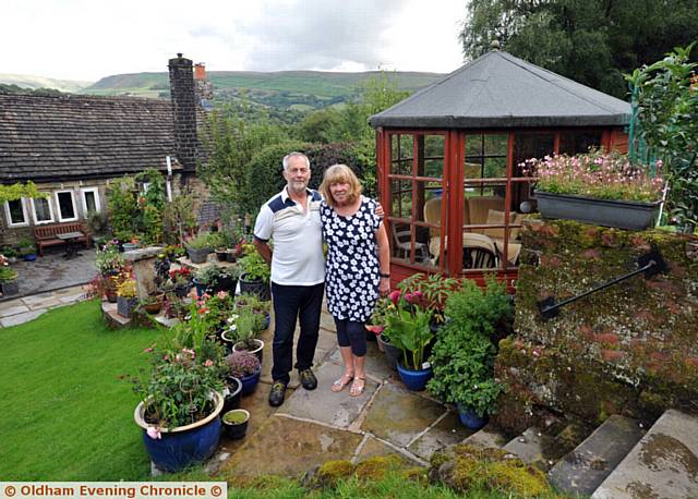 medium garden winners . . . Bill Dean and Eileen Lovsin in their garden in Dobcross