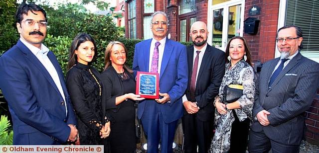 FROM the left: Babar Ali Khan, Naila Akhtar, ex-president of Oldham Law Association, Frances Greenhalgh, vice-chair, presenting a plaque to Mohammed Azam Khan, Zaffar Iqbal, host, Lorraine Mensah, immigration judge, Steve Durham, past president of Oldham Law Association 