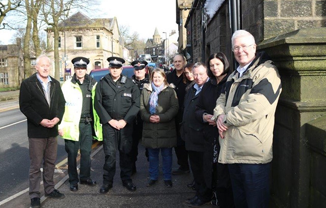 Pictured are Saddleworth District Executive Members with local police in Uppermill centre.