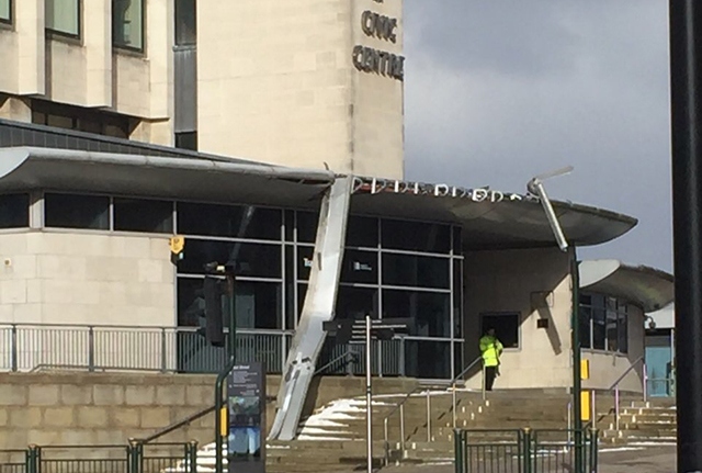The front of the Civic Centre building in Oldham has been damaged by high winds