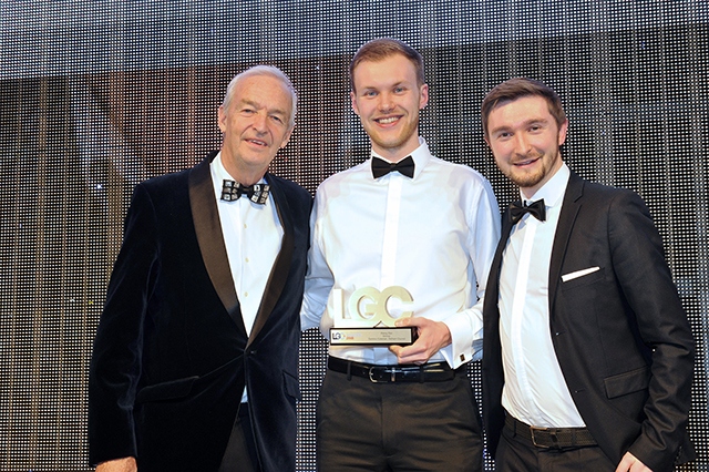 Dominic Coleman (centre) receives his award from John Snow