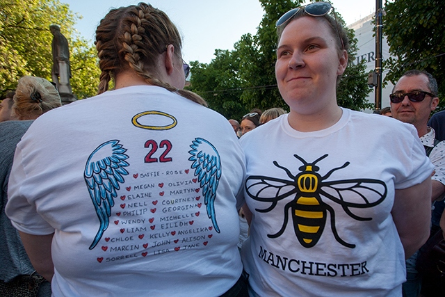 Twins (left to right): Chloe Dent and Katie Dent, both aged 18, with all the names of the 22 victims of the Manchester attack