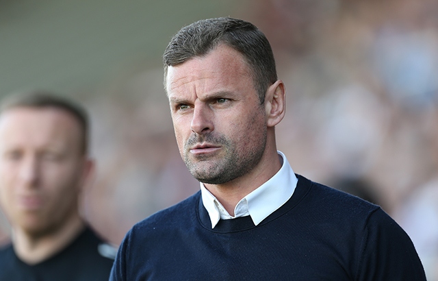 Athletic manager Richie Wellens on the touchline at the Sixfields Stadium
