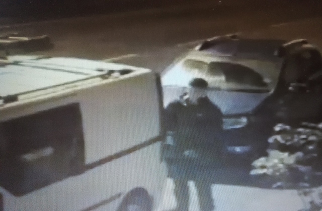 Officers are investigating after a dozen vans were damaged and items stolen