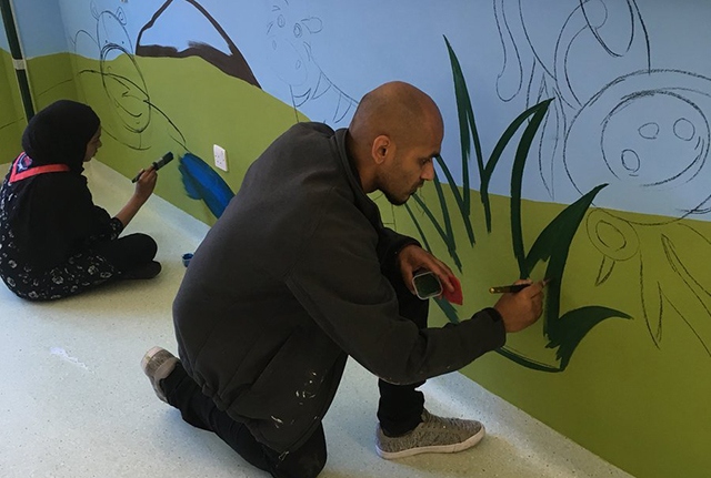 Local artist Javed Saddique pictured at the Royal Oldham Hospital