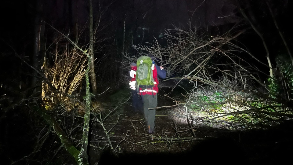 An Oldham Mountain Rescue Team member assists at the Tameside incident during the night