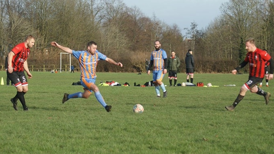 Action from the clash between Old Strets reserves (red and black) and Oldham outfit Santos