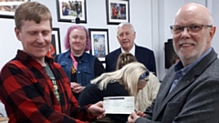 Presenting the cheque for £1,000 to Eric Steele, Director at Hack, is Saddleworth Rotary President Jon Stocker