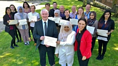 MP Debbie Abrahams pictured with Bryn Hughes, founder of the PC Nicola Hughes Memorial Fund, and Summer Schools students at their graduation day