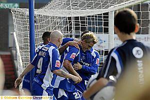 WELL DONE, MATE: Daniel Jones is congratulated by team-mates after scoring the third goal