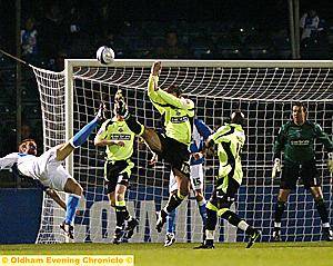 ATHLETIC captain Sean Gregan attempts to block an effort from Bristol Rovers striker Rickie Lambert.