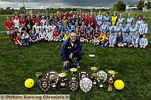 COACH Steve Grice with his teams of Angels and their trophies COACH Steve Grice with his teams of Angels and their trophies