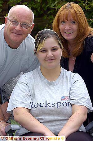 DONNA MOORE (centre) with her former foster carers Barry and Yvonne Cossins DONNA MOORE (centre) with her former foster carers Barry and Yvonne Cossins